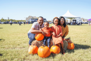we love our residents - family in a pumpkin patch