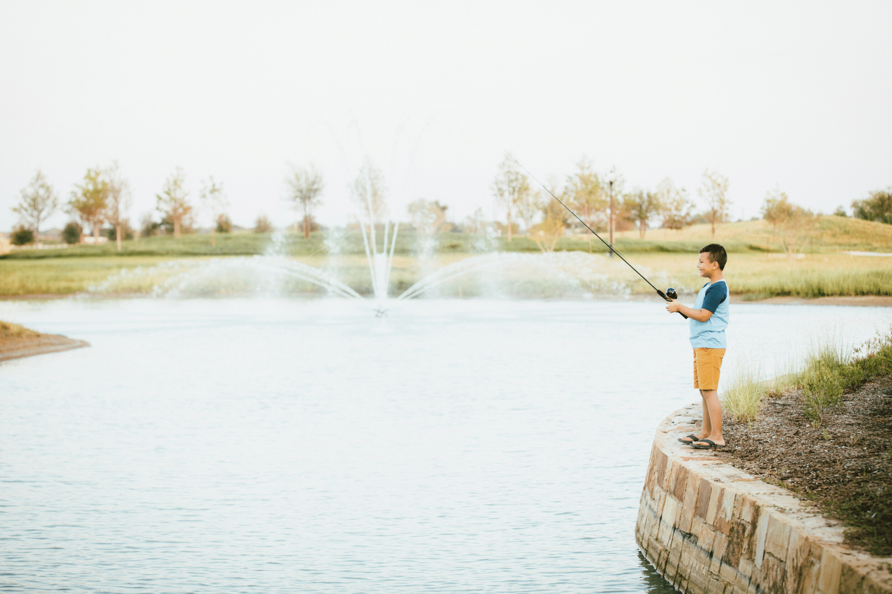 Boy Fishing at Lake