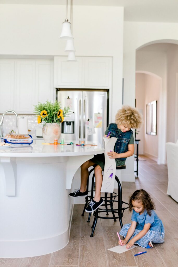 Children drawing in the kitchen of a Sandbrock Ranch home
