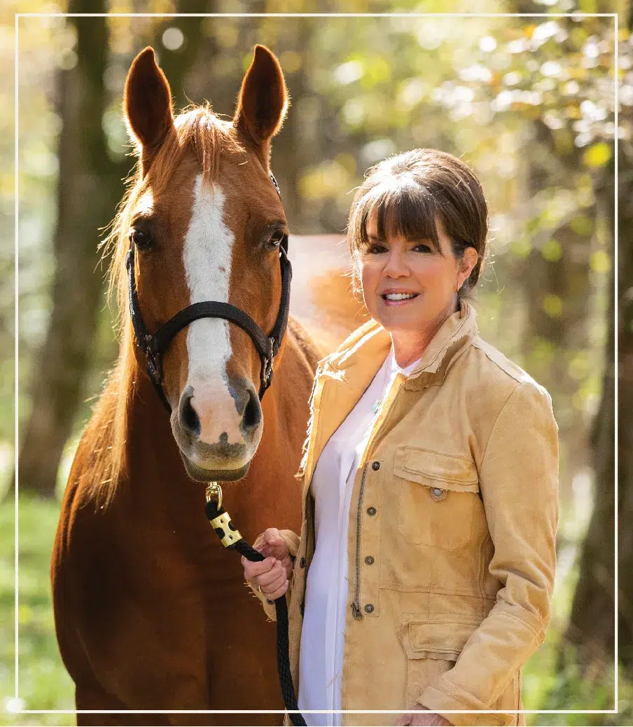 Jeanne Ann Brock with a horse at Sandbrock Ranch